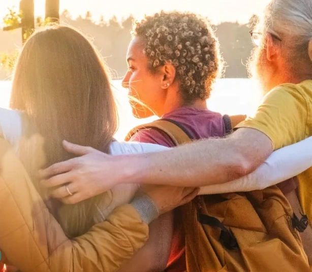 Friends and family sharing a warm moment outdoors